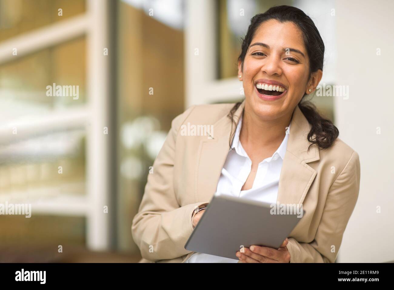 Hispanic business woman smiling outside stock photo Stock Photo