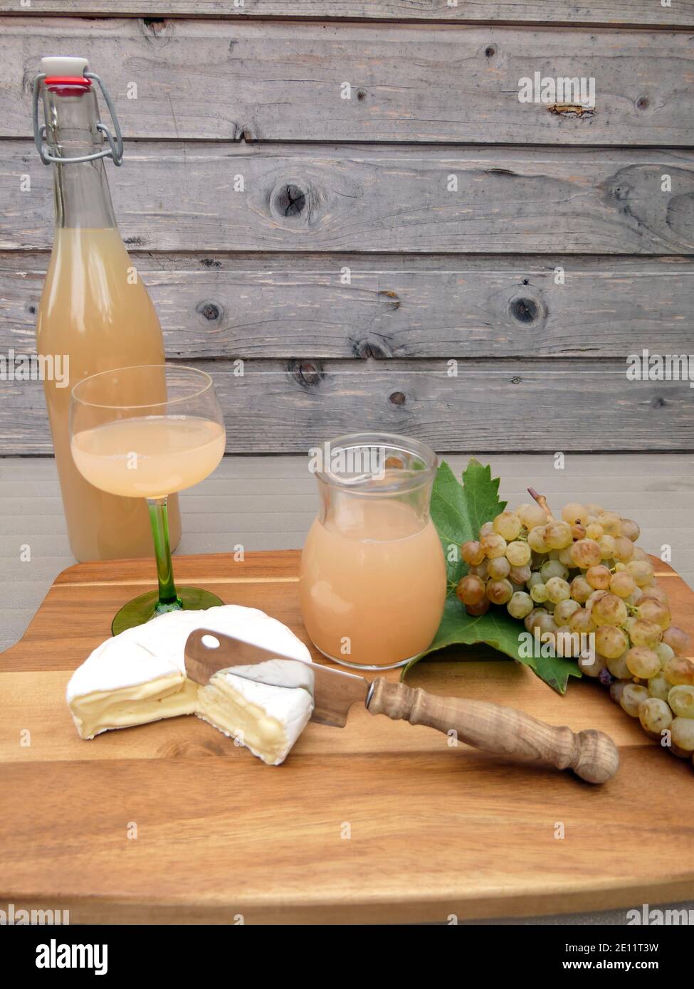 Freshly Pressed Out Grape Juice With A Bunch Of White Grapes And Cheese