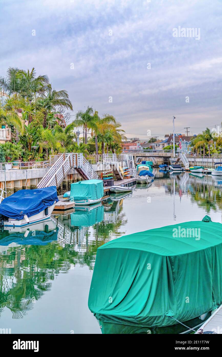 Canal with boats and stairs going to dock in Long Beach California neighborhood Stock Photo Alamy
