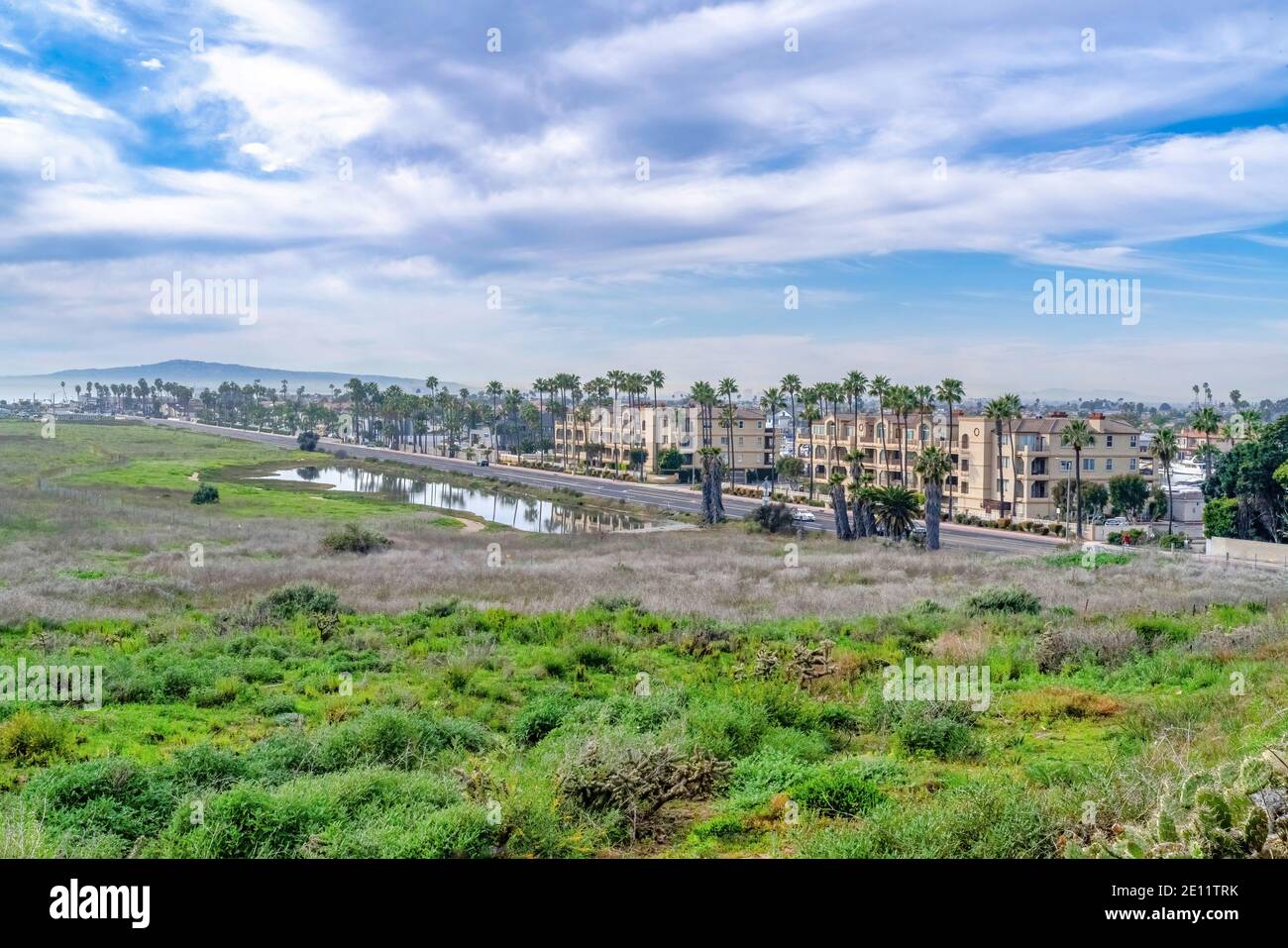 Huntington Beach California scenic landscape with pond grass land and  buildings Stock Photo - Alamy