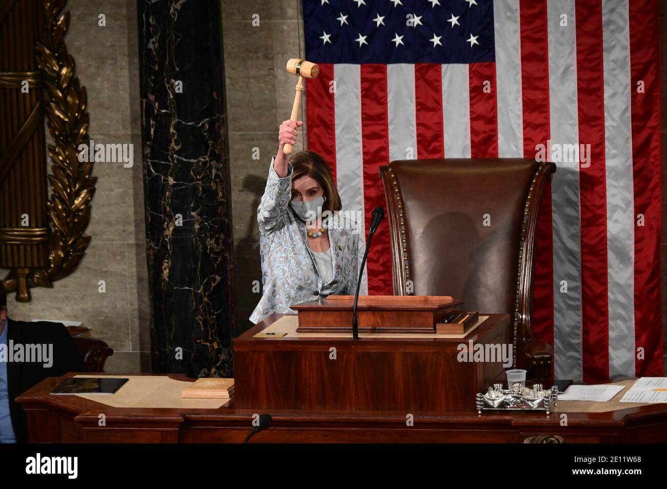 Washington, USA. 03rd Jan, 2021. U.S. Speaker of the House Nancy Pelosi wields the Speaker's gavel after being re-elected as Speaker and preparing to swear in members of the 117th House of Representatives in Washington, U.S., January 3, 2021. (Photo by Erin Scott/Pool/Sipa USA) Credit: Sipa USA/Alamy Live News Stock Photo