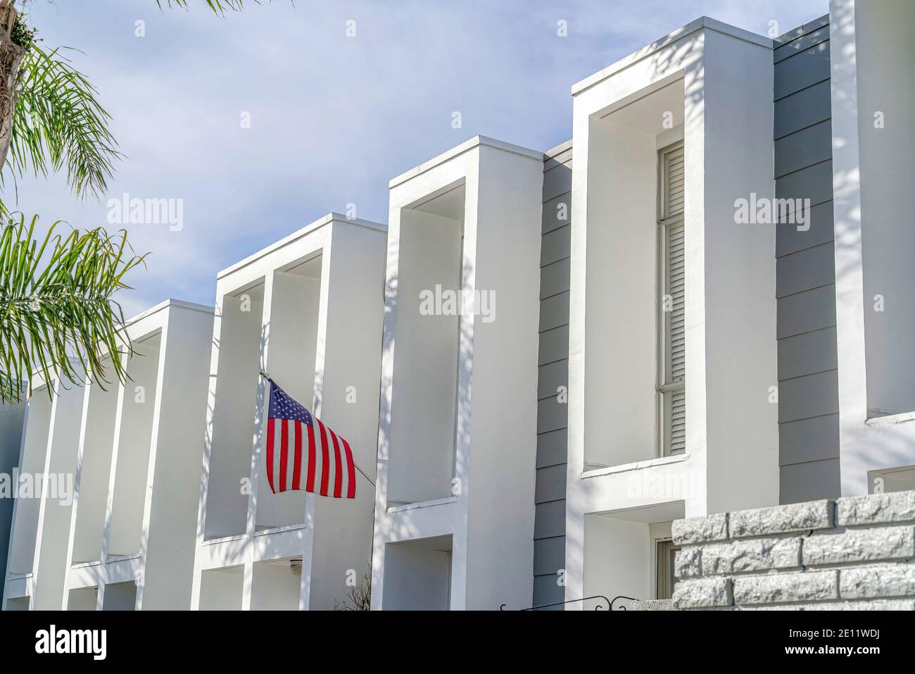 Modern residential building exterior with flat roof and projecting ...