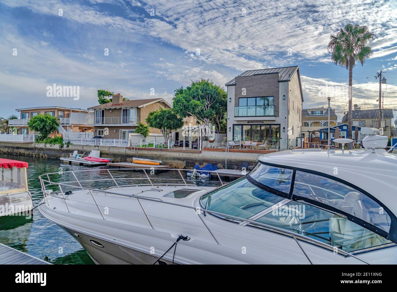 Yachts and boats along Huntington Beach harbour with waterfront homes