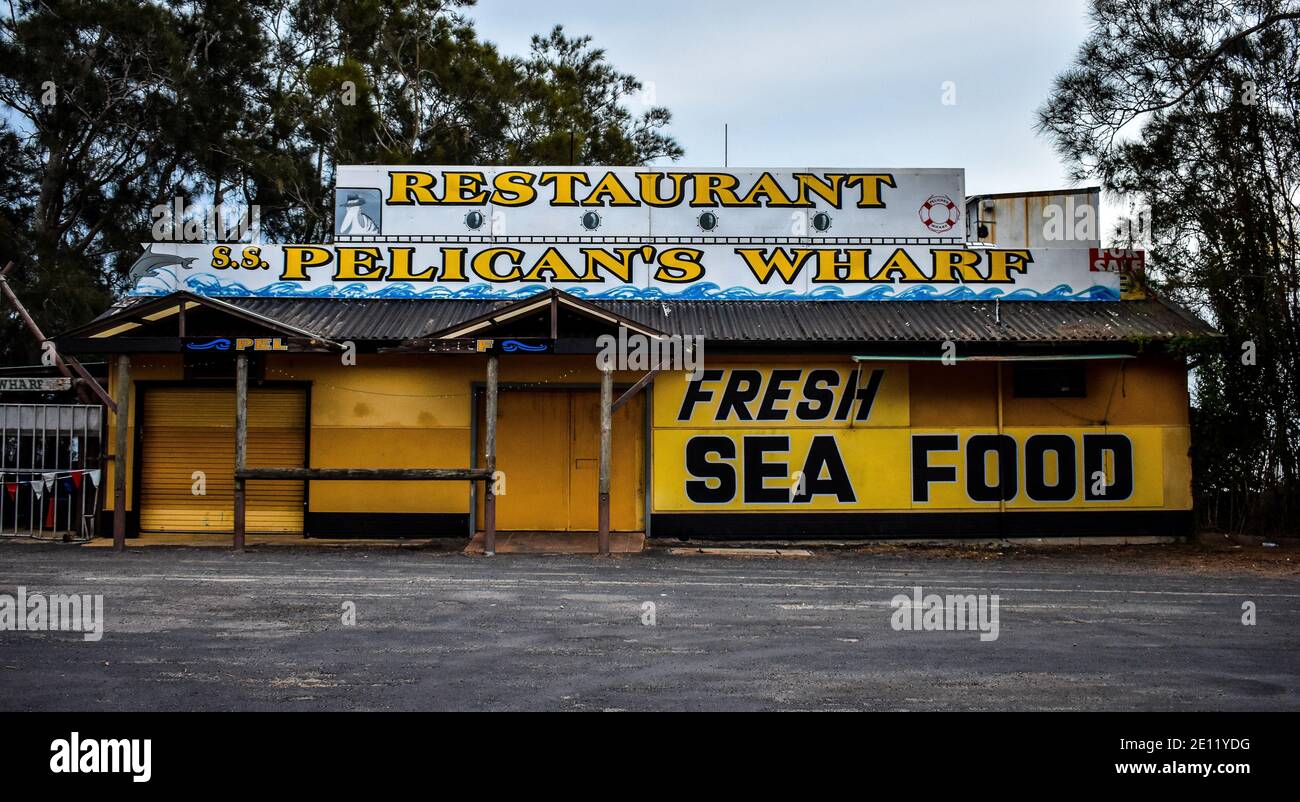 a sign for Pelican's Wharf Restaurant  near Gosford Stock Photo
