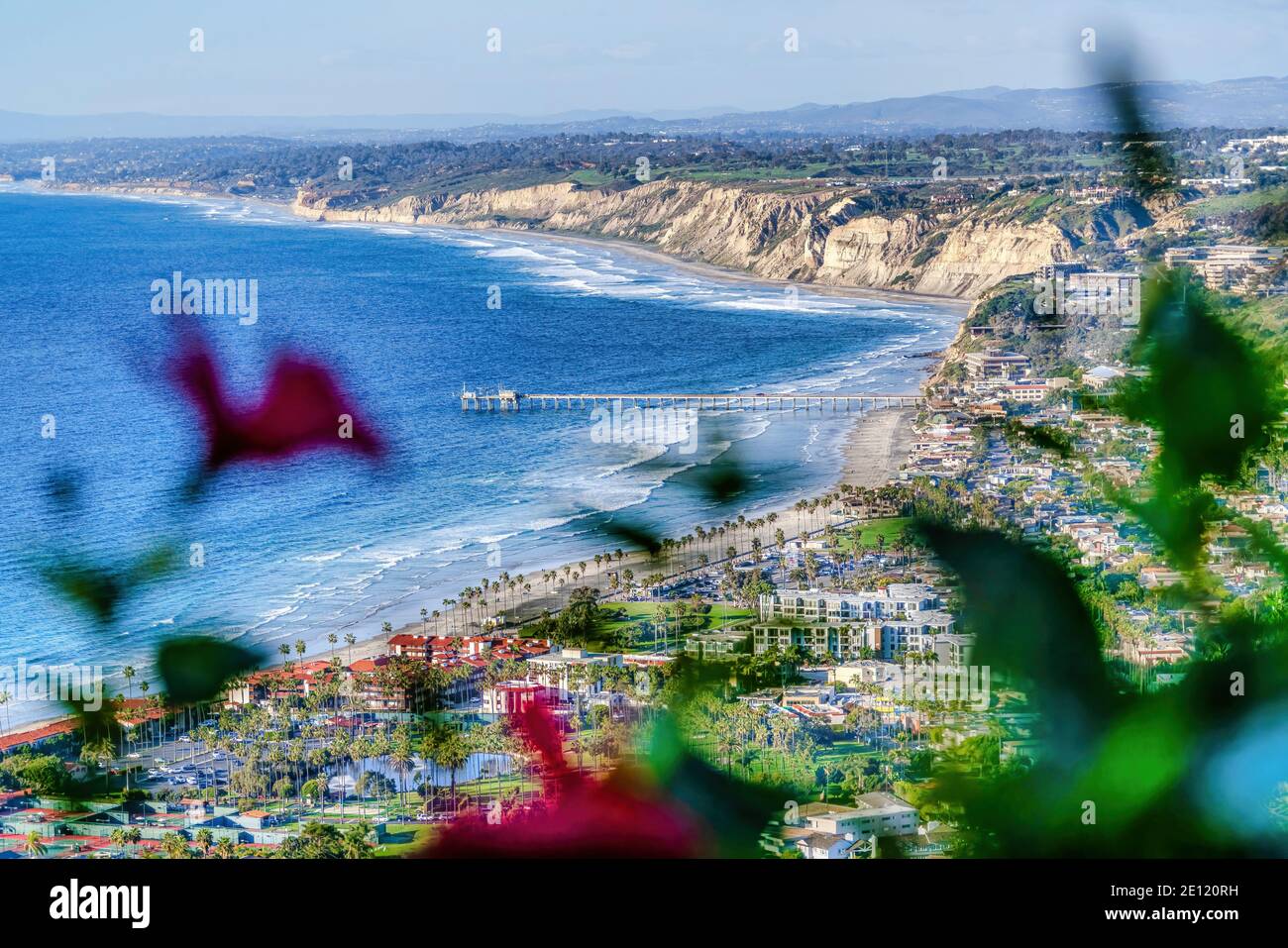 Blue ocean with pier at San Diego California with cloudy sky on an aerial view Stock Photo