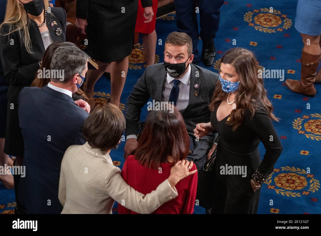 Washington, United States. 03rd Jan, 2021. Representative-elect Madison Cawthorn (R-NC) speaks to others prior to the swearing in of the new 117th Congress on Capitol Hill on January 3, 2021 in Washington DC. Photo by Ken Cedeno/Sipa USA Credit: Sipa USA/Alamy Live News Stock Photo