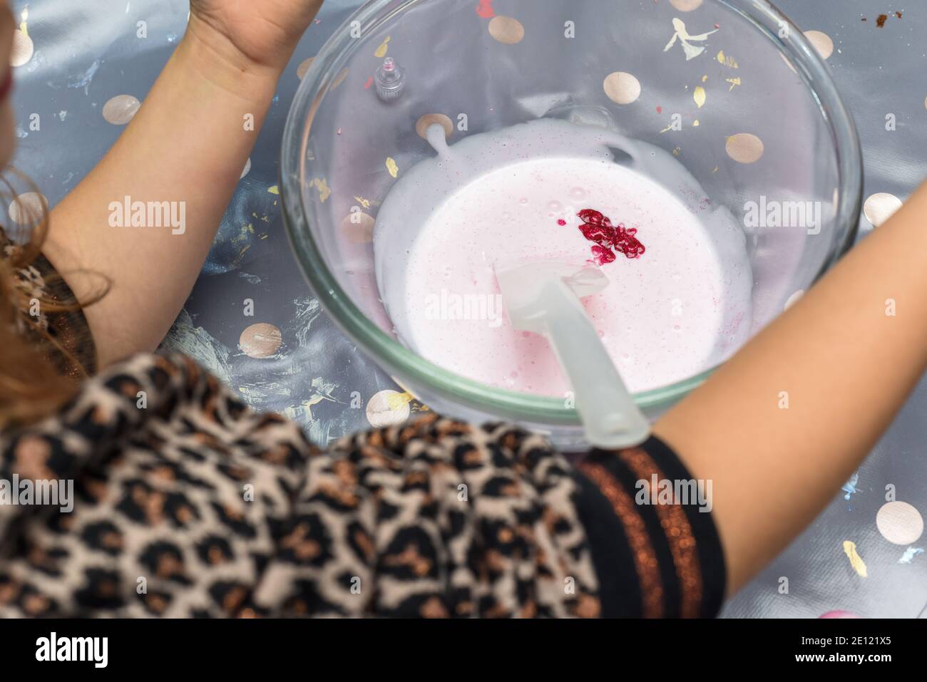 Kids activity of making slime as a science experiment for children to do indoors Stock Photo