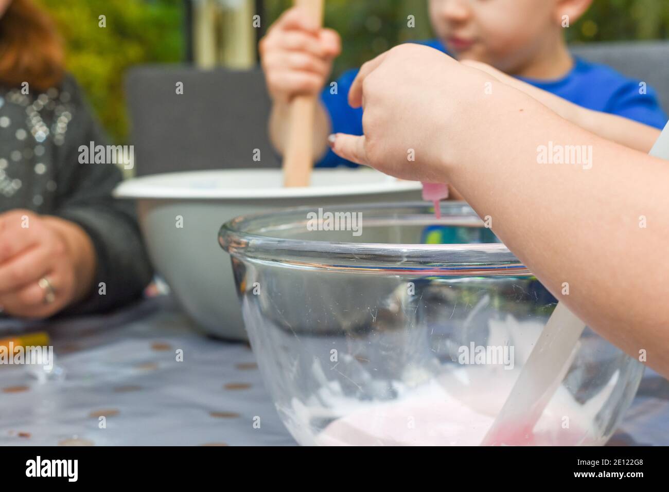 Kids activity of making slime as a science experiment for children to do indoors Stock Photo