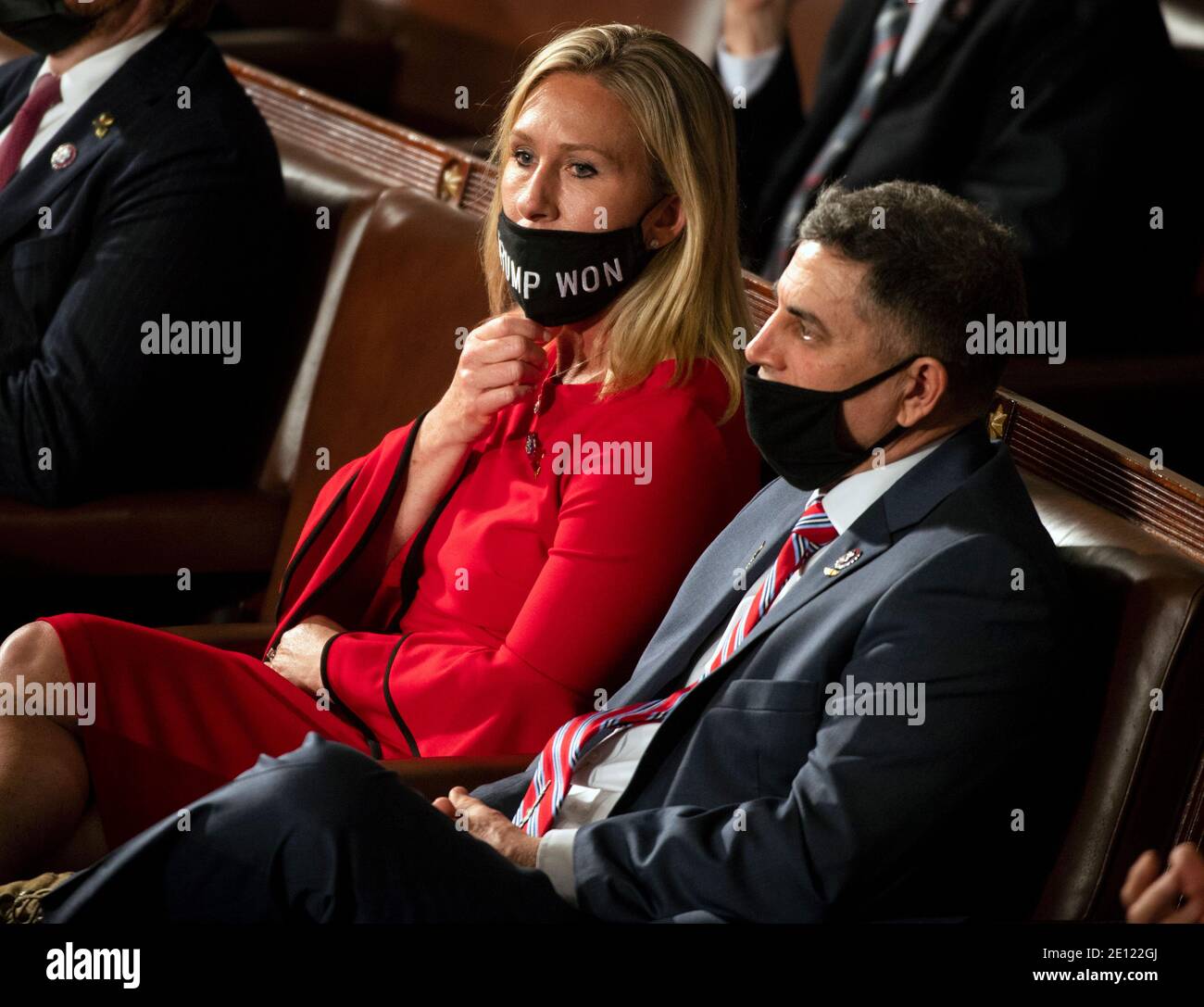 United States Representative Marjorie Taylor Greene (Republican of Georgia) waits to be sworn in on the opening day of the 117th Congress with her mask that says “Trump won” pulled below her nose at the U.S. Capitol in Washington, DC on January 03, 2021.Credit: Bill O'Leary/Pool via CNP | usage worldwide Stock Photo