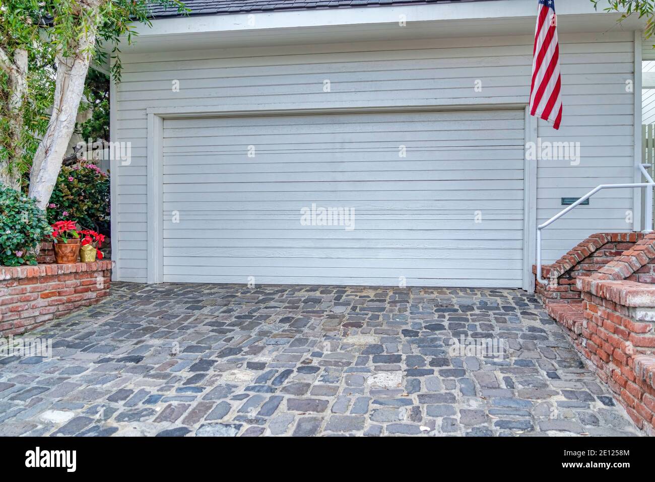 Garage of house in San Diego California with white door and wall