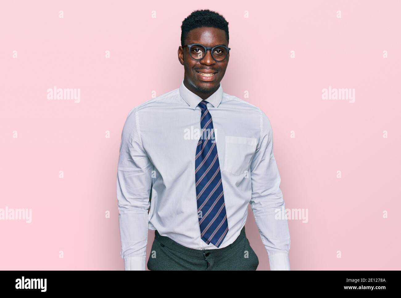 Handsome business black man wearing white shirt and tie looking ...