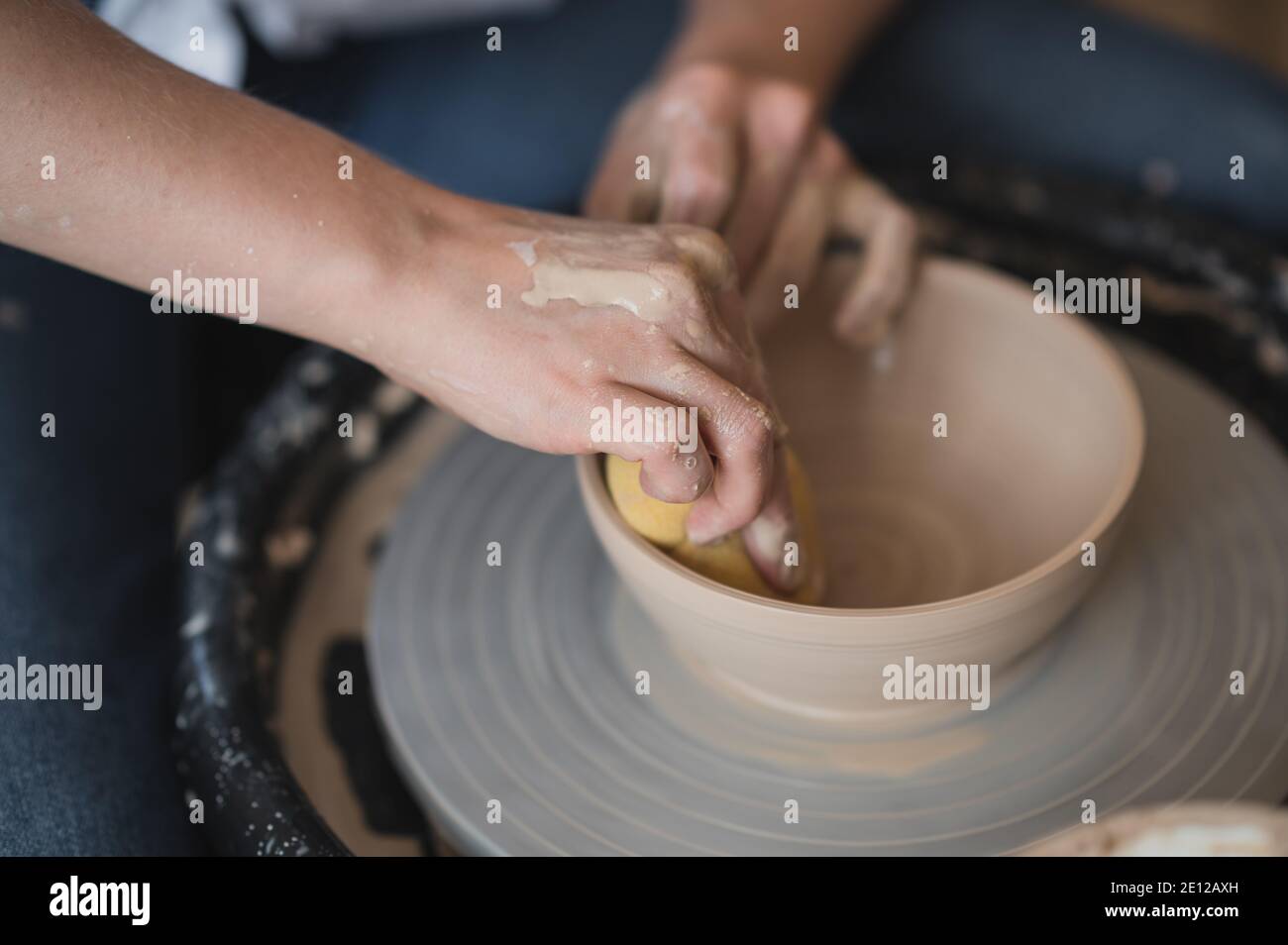 Potter makes the clay product with pottery modeling tools on the potter