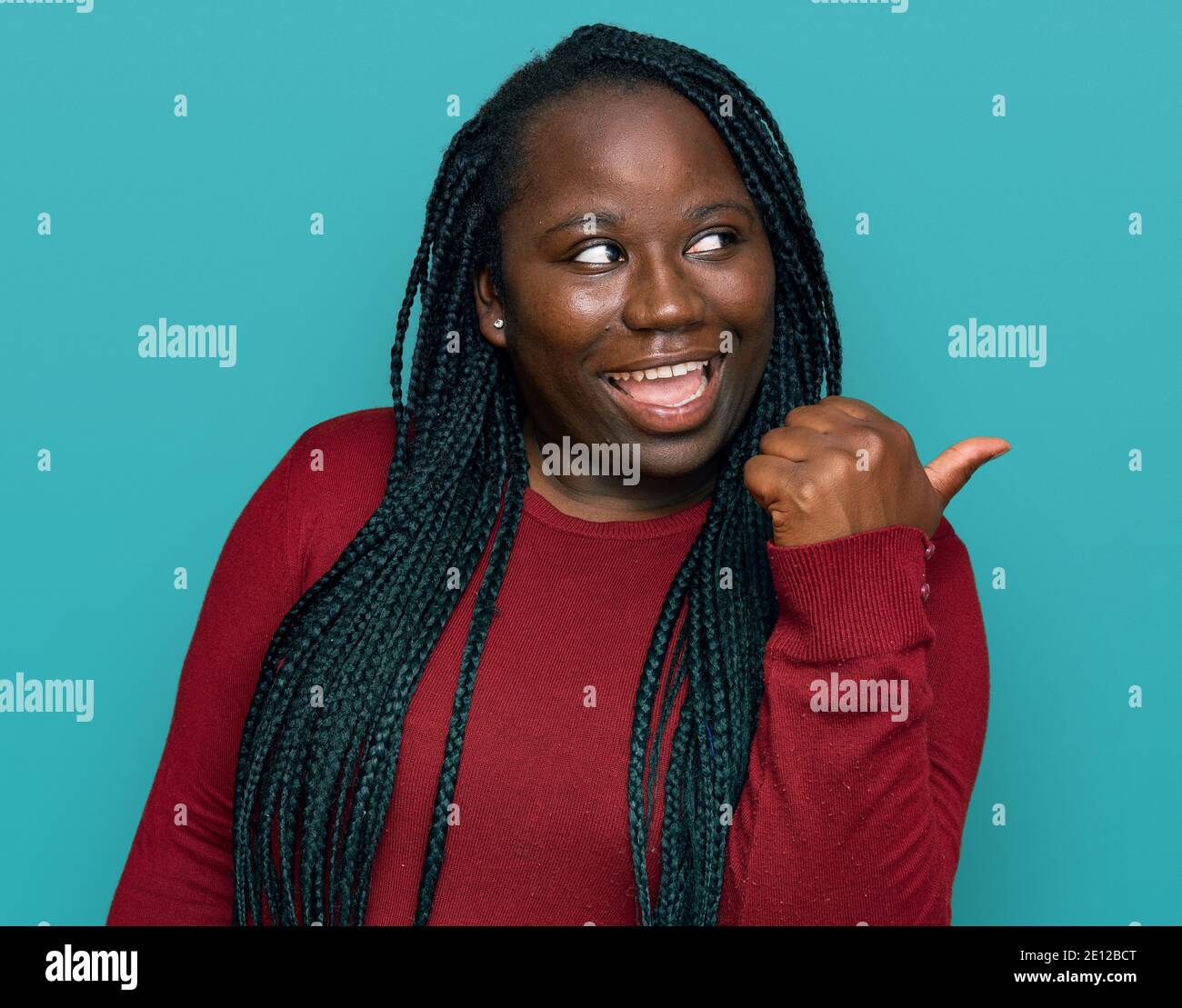 Young black woman with braids wearing casual clothes smiling with happy ...