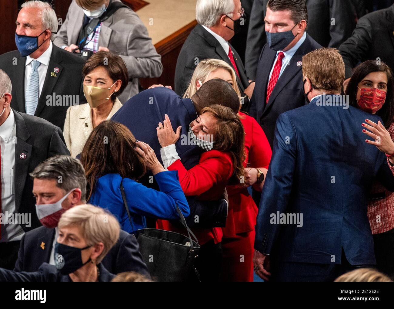 Washington, United States Of America. 03rd Jan, 2021. Newly sworn in House members mingle and congratulate each other on the opening day of the 117th Congress at the at the U.S. Capitol in Washington, DC on January 03, 2021. Credit: Bill O'Leary/Pool via CNP/dpa/Alamy Live News Stock Photo