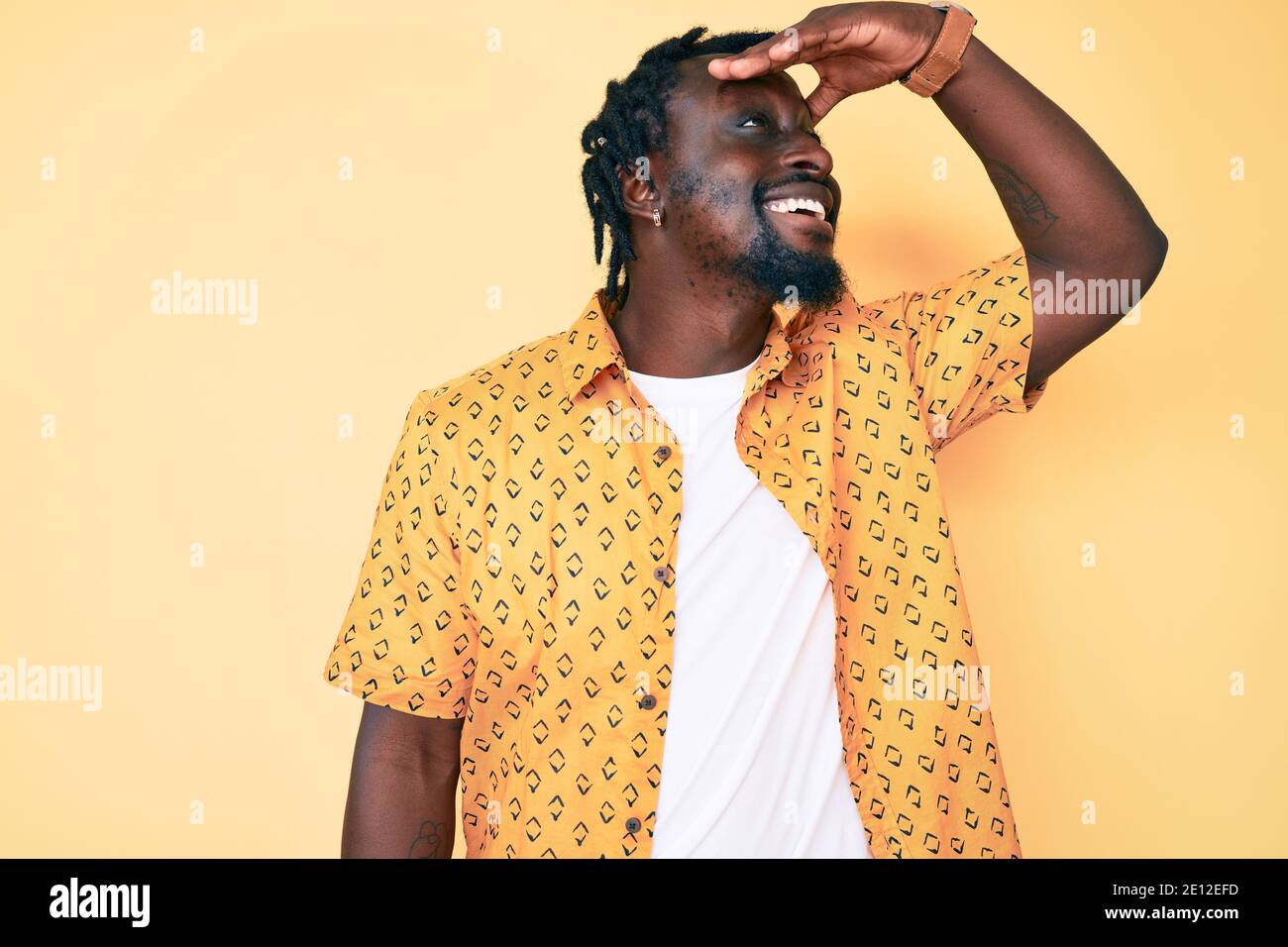 Young african american man with braids wearing casual clothes very ...