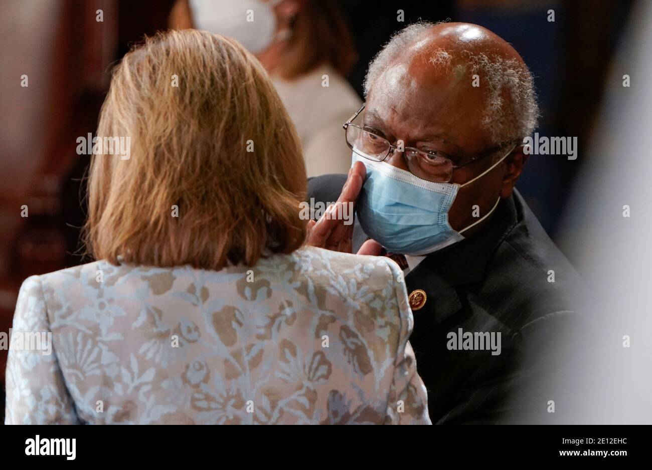 House Majority Whip Rep. James Clyburn (D-SC) whispers to Speaker of the House Nancy Pelosi during the first session of the 117th Congress after she was re-elected Speaker on Capitol Hill in Washington, U.S., January 3, 2021.   REUTERS/Joshua Roberts Stock Photo