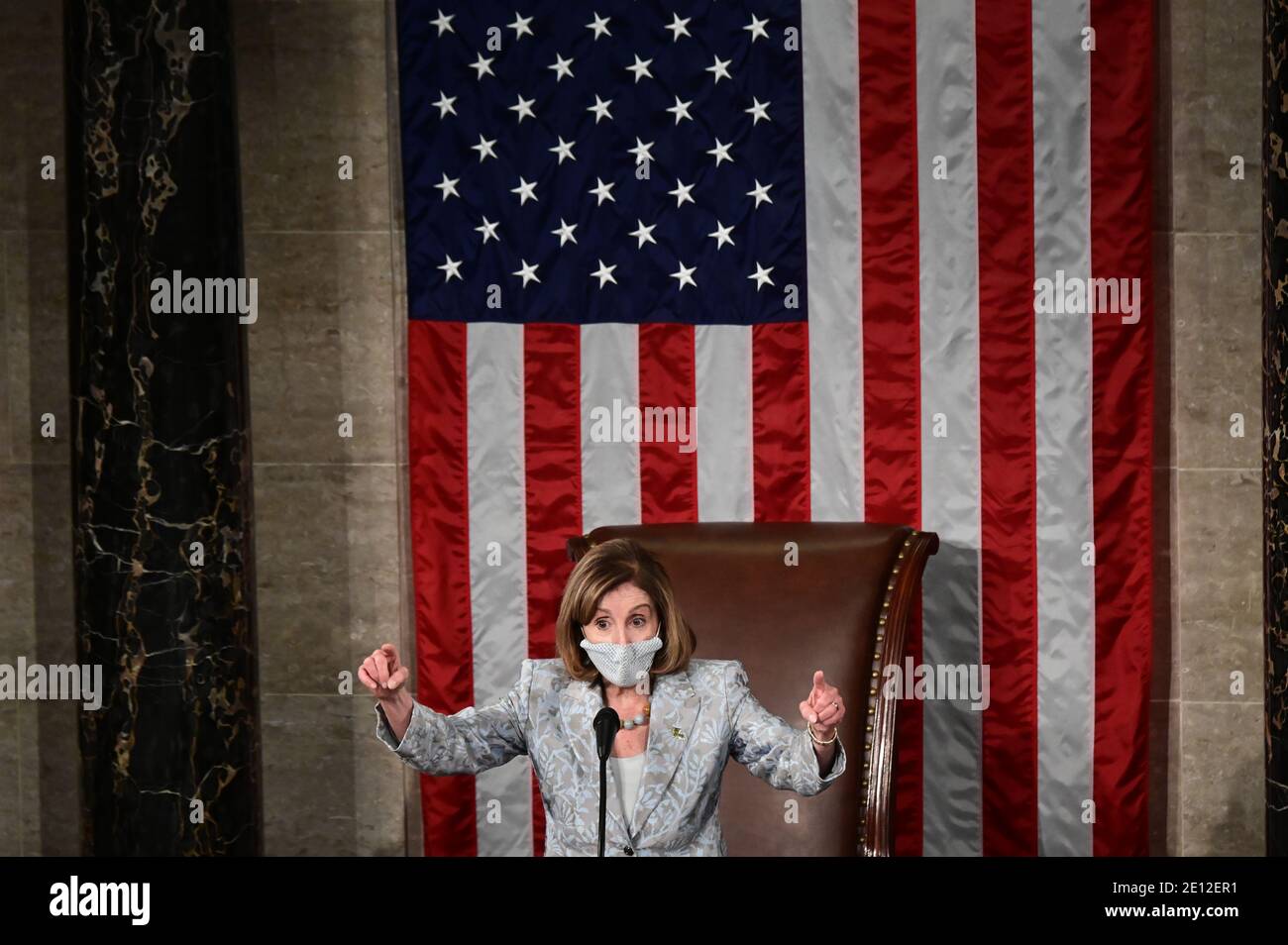 Washington, USA. 03rd Jan, 2021. U.S. Speaker of the House Nancy Pelosi leads the first session of the 117th House of Representatives after being re-elected as Speaker and administering the oath of office to members in Washington, U.S., January 3, 2021. (Photo by Erin Scott/Pool/Sipa USA) Credit: Sipa USA/Alamy Live News Stock Photo