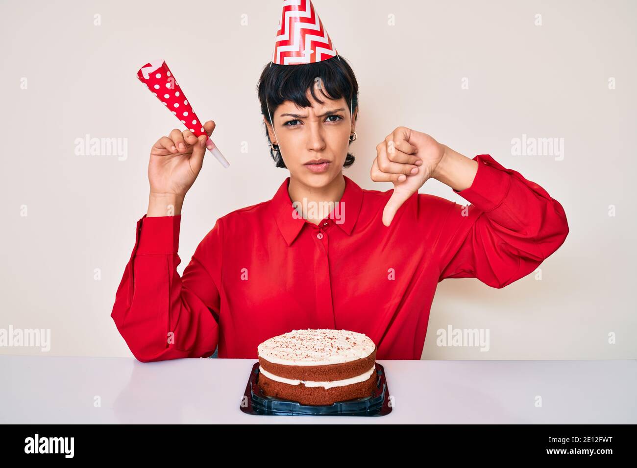 Beautiful brunettte woman with short hair celebrating birthday with ...