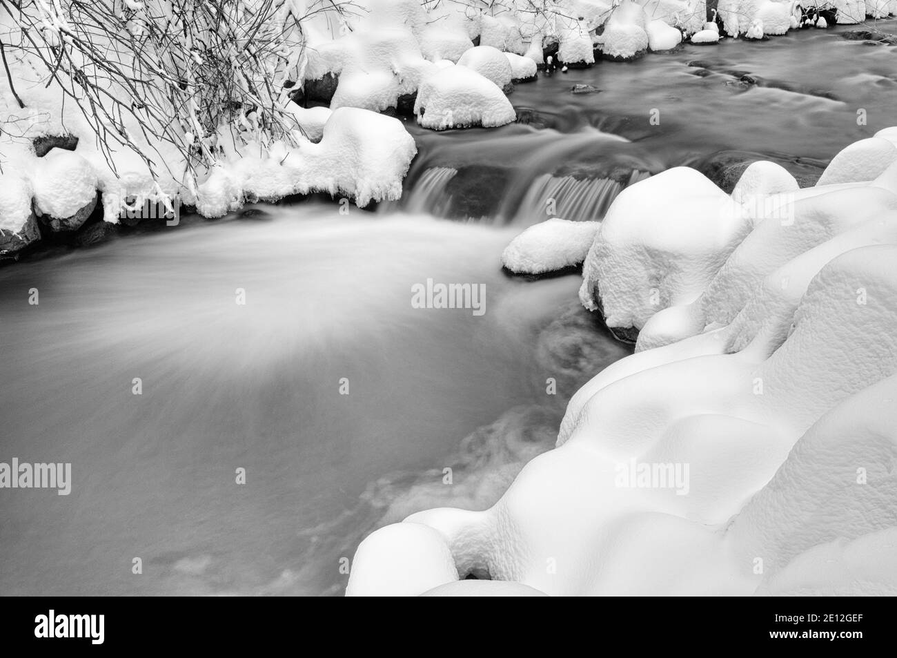 Fresh snow by a river in Quebec, Canada Stock Photo