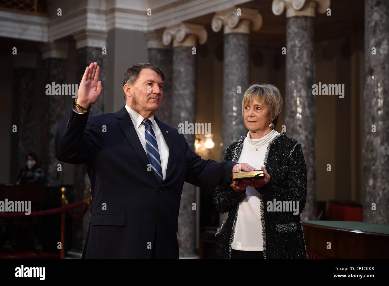 United States Senator Mike Rounds (Republican of South Dakota), participates in a mock swearing-in for the 117th Congress with Vice President Mike Pence, as his wife Jean Rounds holds a bible, in the Old Senate Chambers at the U.S. Capitol Building in Washington, DC on Sunday, January 3, 2021. Credit: Kevin Dietsch/Pool via CNP/MediaPunch Stock Photo