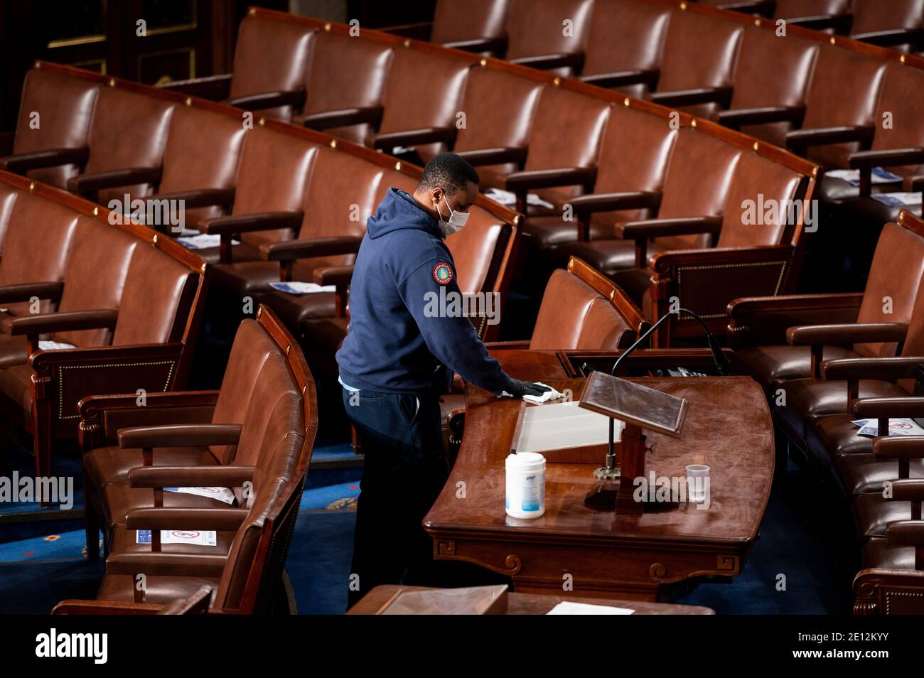 United States Capitol workers disinfect the House floor in the Capitol before members of the 117th Congress are sworn in on Sunday, January 3, 2021. Credit: Bill Clark/Pool via CNP /MediaPunch Stock Photo