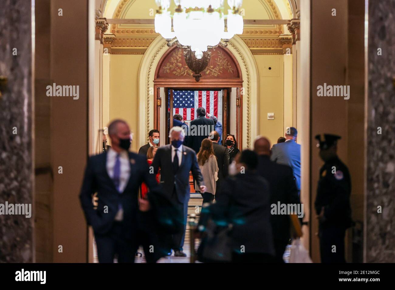 WASHINGTON, DC - JANUARY 03: Members and guests wait outside the House chamber in the US Capitol on January 03, 2021 in Washington, DC. Both chambers are holding rare Sunday sessions to open the new Congress on January 3 as the Constitution requires.  (Photo by Tasos Katopodis/Pool/Sipa USA) Stock Photo
