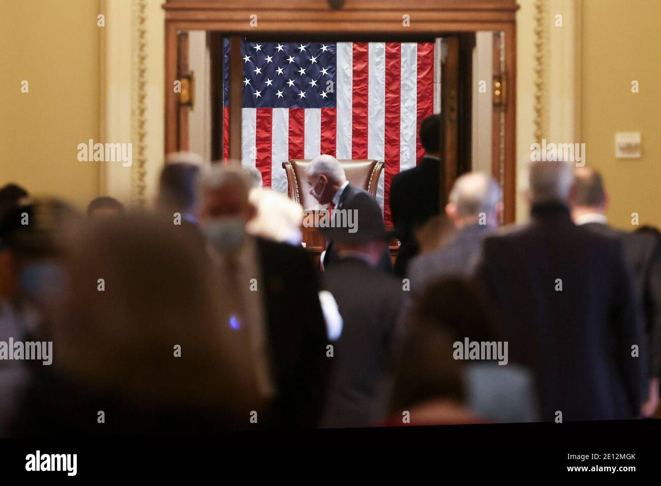 WASHINGTON, DC - JANUARY 03: Members and guests wait outside the House chamber in the US Capitol on January 03, 2021 in Washington, DC. Both chambers are holding rare Sunday sessions to open the new Congress on January 3 as the Constitution requires.  (Photo by Tasos Katopodis/Pool/Sipa USA) Stock Photo