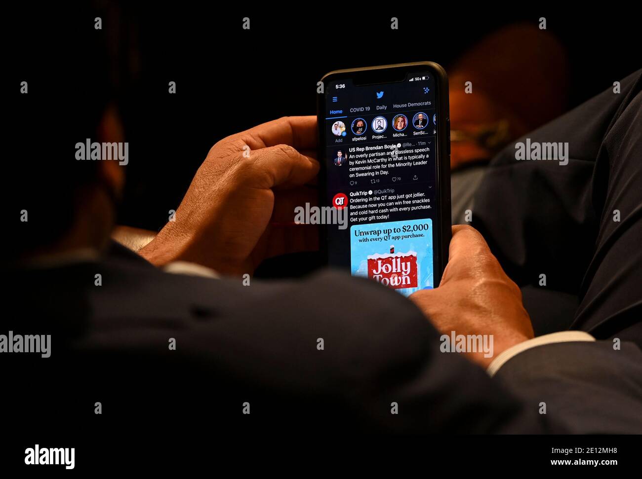 A United States House member checks his phone on the opening day of the 117th Congress at the U.S. Capitol in Washington, DC on January 03, 2021. Credit: Bill O'Leary/Pool via CNP /MediaPunch Stock Photo