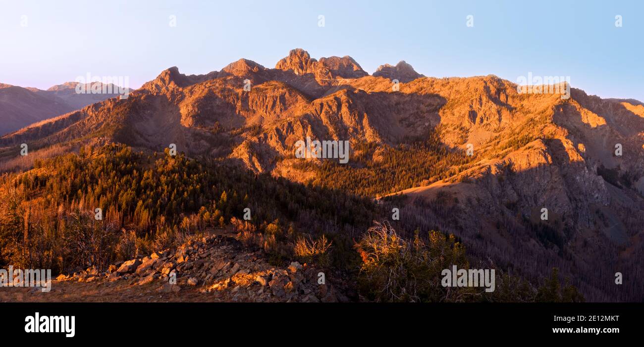 Panoramic image of sunrise at Seven Devils from Heaven's Gate lookout; some smoke form forest fires visible in the background. Stock Photo