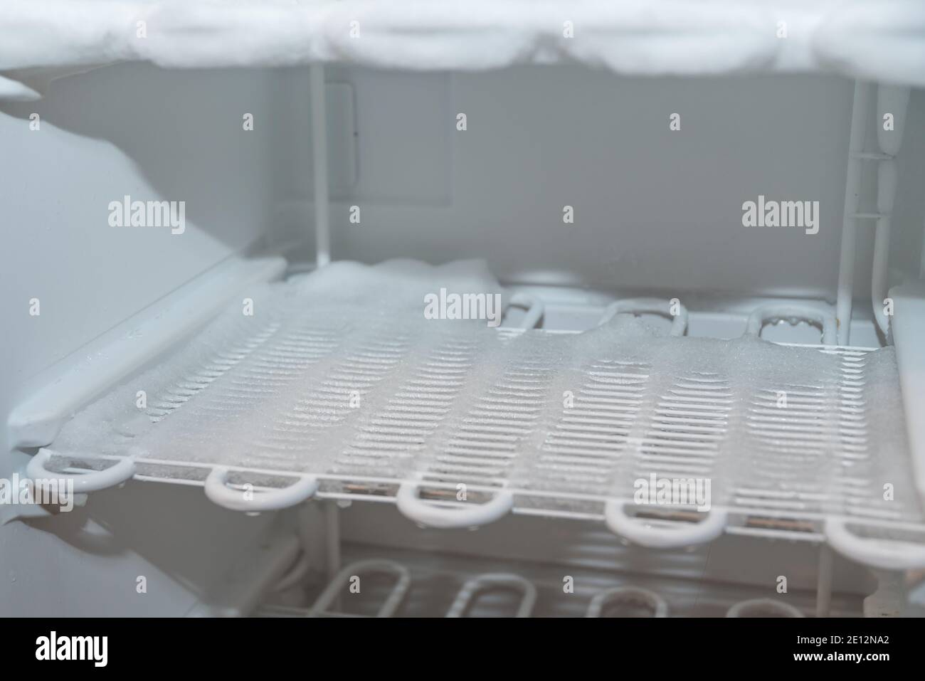 Iced Freezer - Close-up Of Cooling Fins Of A Freezer Stock Photo