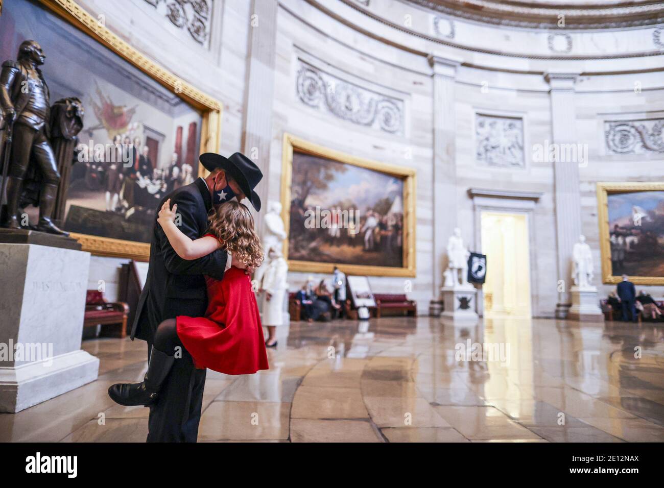 Washington, United States. 03rd Jan, 2021. Representative-elect Troy Nehls (R-TX) hugs daughter Tori Nehls in the US Capitol on Sunday, January 3, 2021 in Washington, DC. Both chambers are holding rare Sunday sessions to open the new Congress on January 3, as the Constitution requires. Pool photo by Tasos Katopodis/UPI Credit: UPI/Alamy Live News Stock Photo