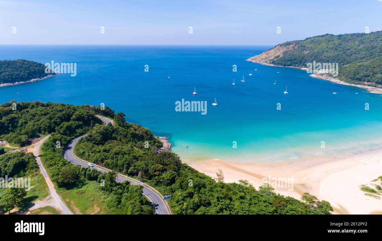 Aerial view of curve road along the Naiharn beach at Phuket Thailand beautiful sandy beach and open sea in summer season After Covid-19,December 9, 20 Stock Photo