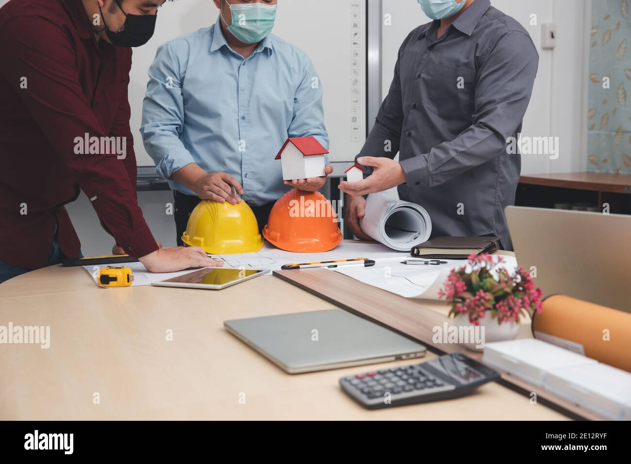 Engineer and Architect concept, Engineer Architects  and Interior designer working with blueprints Stock Photo