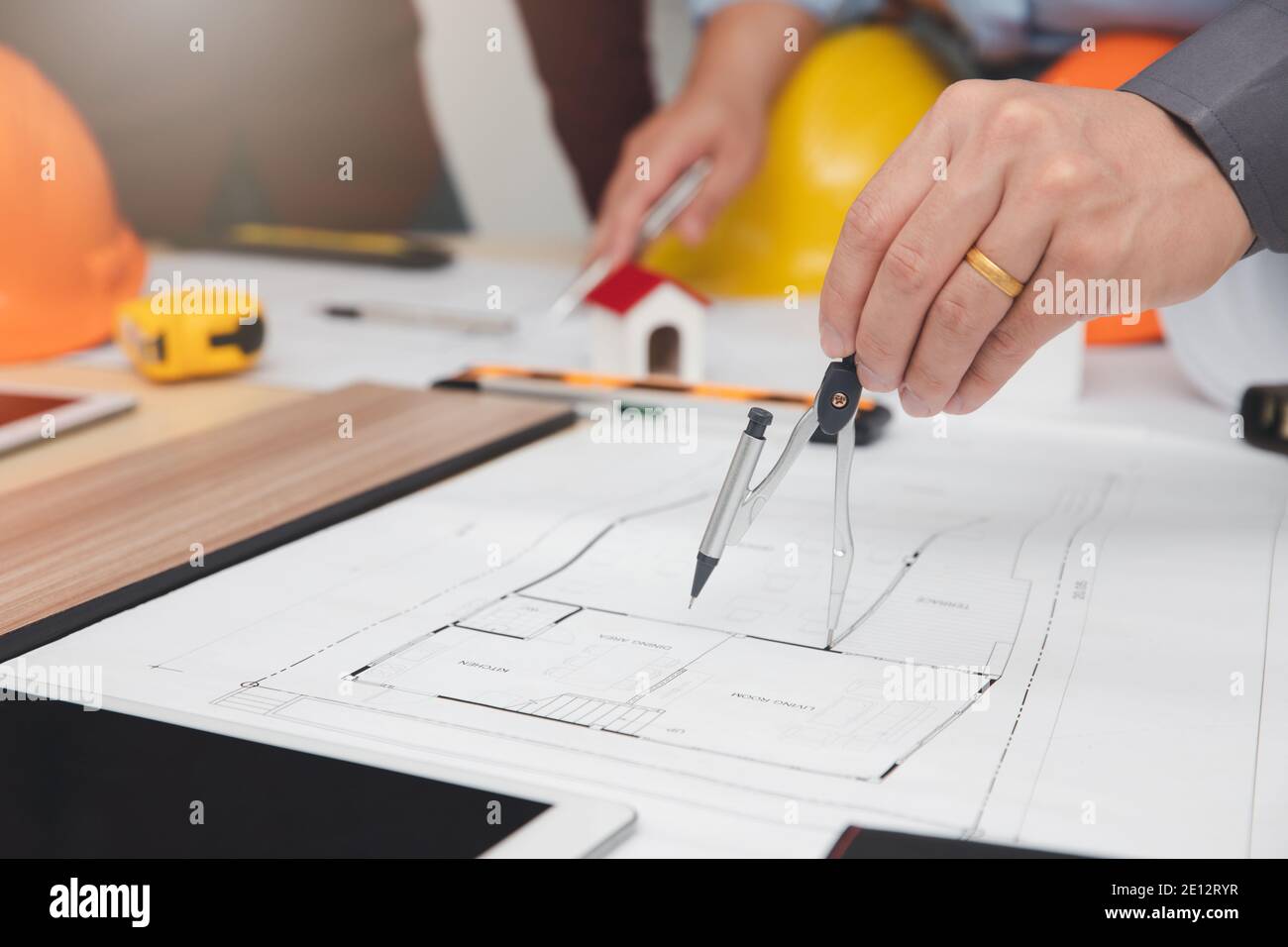 Engineer and Architect concept, Engineer Architects  and Interior designer working with blueprints Stock Photo