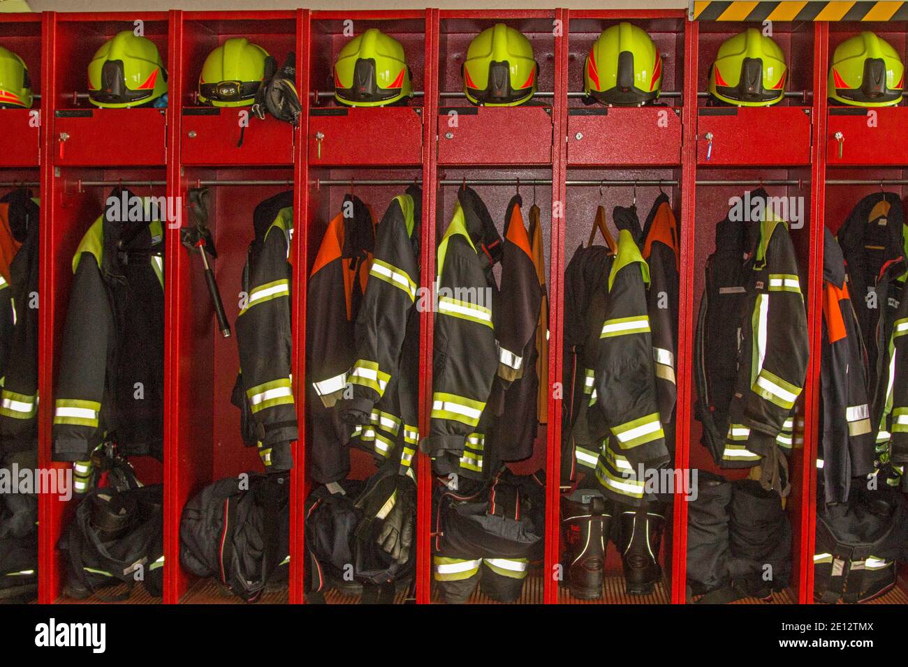 A Look Into The Neatly Organized And Well-organized Clothing And Equipment Locker Of A Fire Station Stock Photo