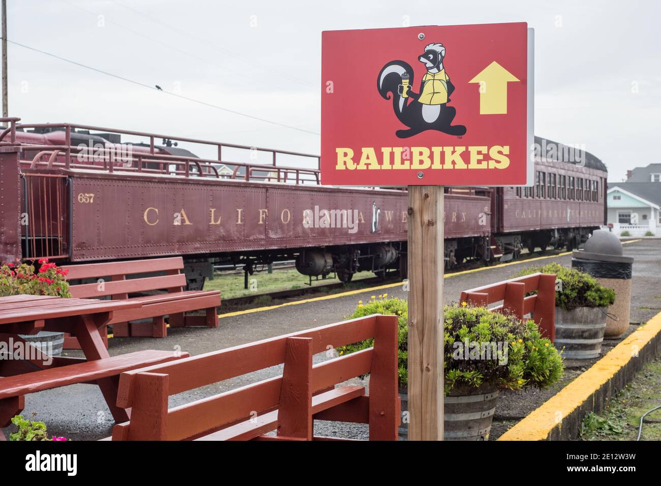 A sign pointing the way for skunk train railbikes in Fort Bragg
