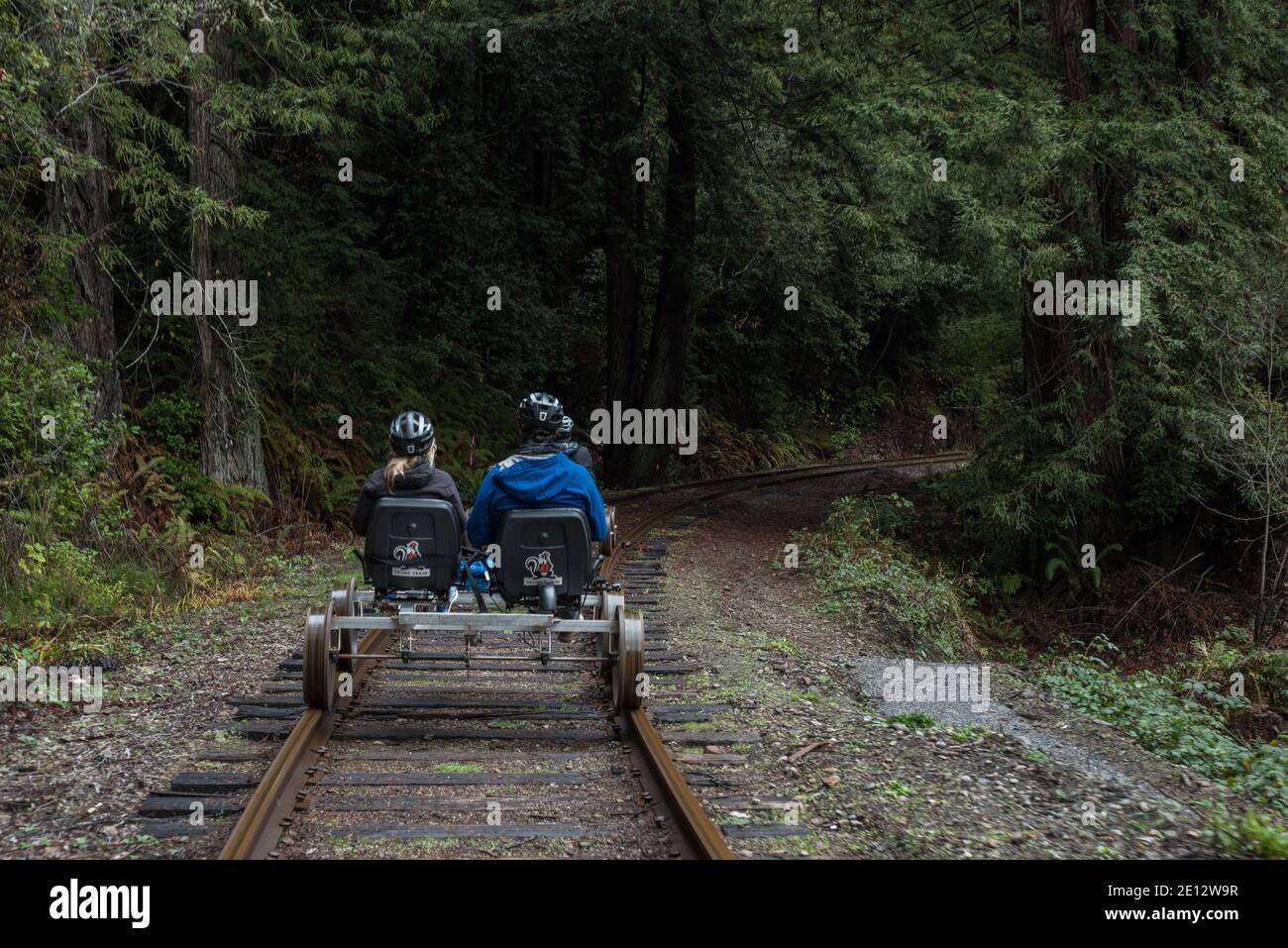 Tourists ride railbikes along the skunk train railroad in Fort Bragg