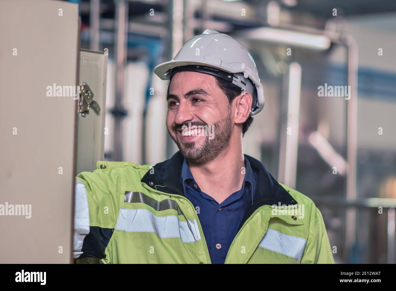 Worker Engineer working machine in factory are Engineering control Stock Photo