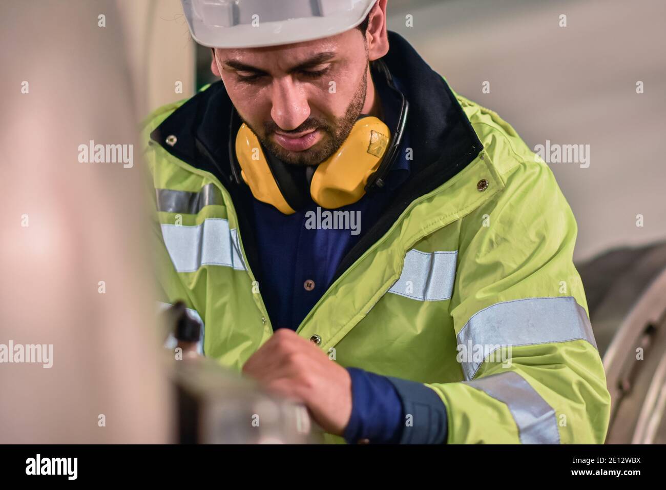 Worker Engineer working machine in factory are Engineering control Stock Photo