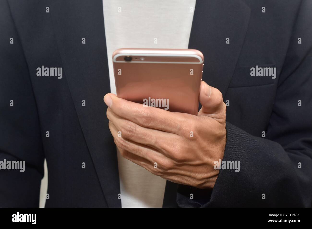 Hand holding mobile smartphone white background Stock Photo - Alamy