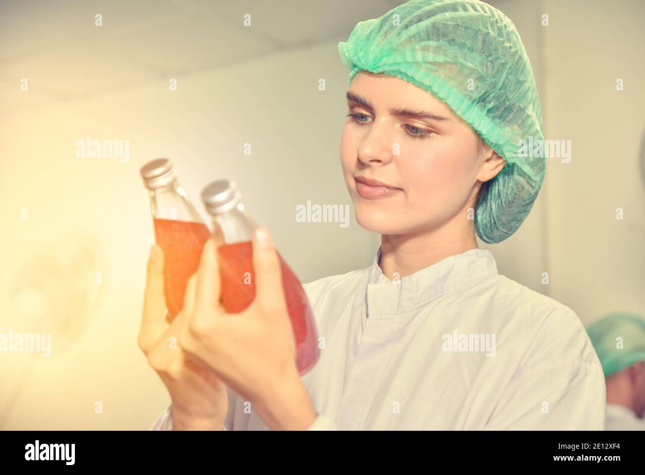 Woman Quality Control Women inspection quality control in beverage factory Stock Photo - Alamy