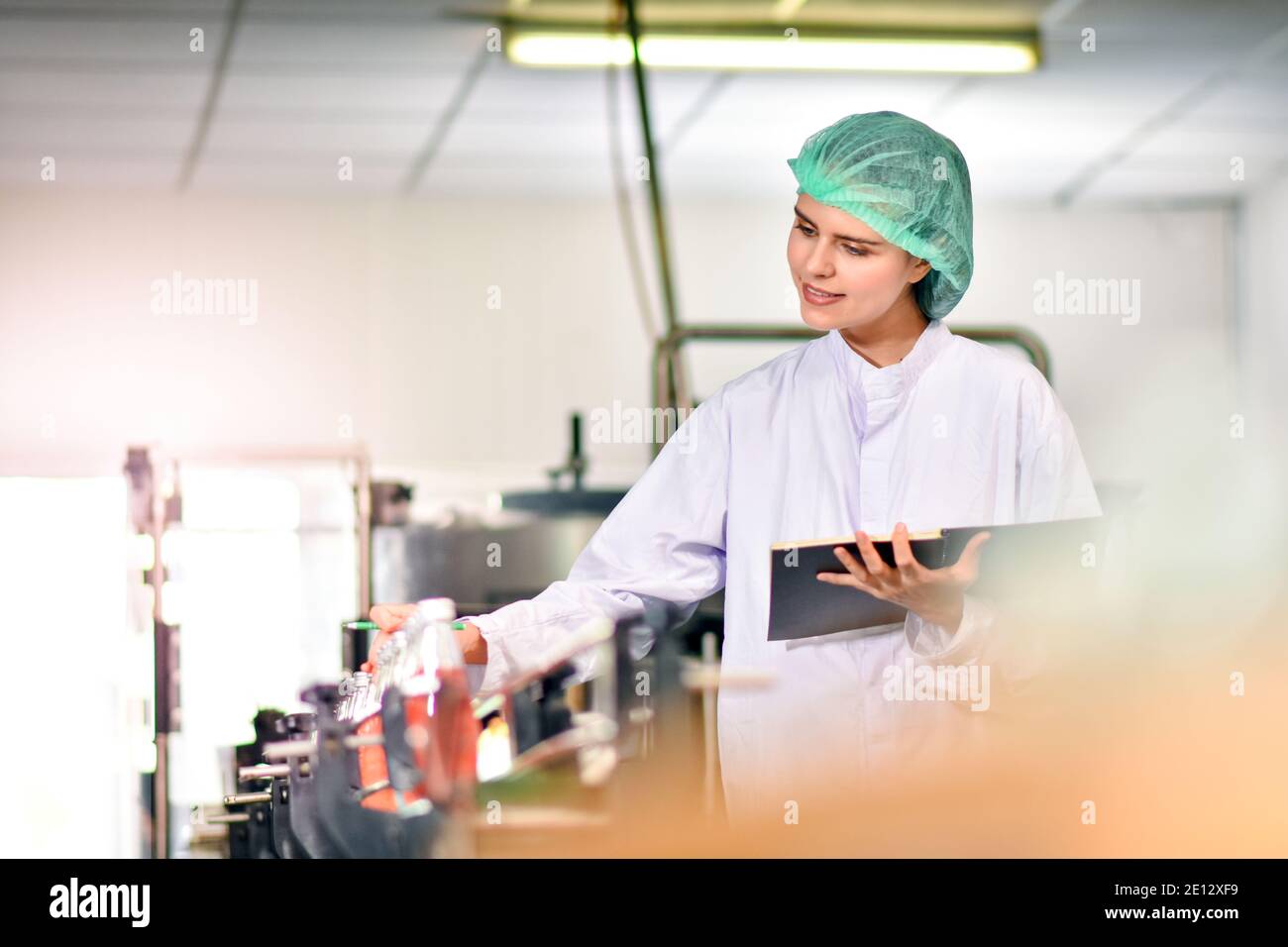 Woman Quality Control Women inspection quality control in beverage factory Stock Photo - Alamy