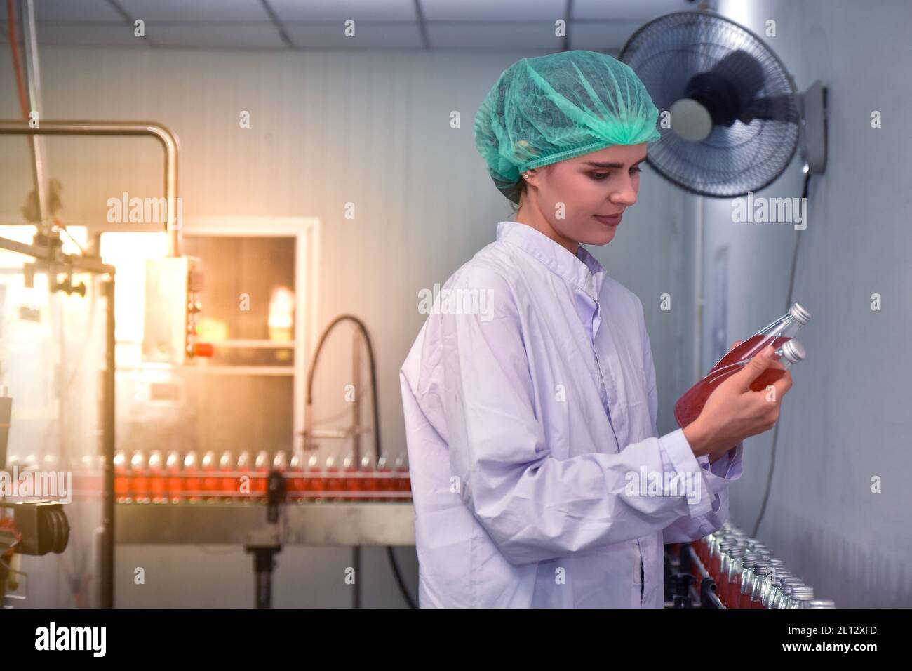 Women inspection quality control in beverage factory Stock Photo Alamy