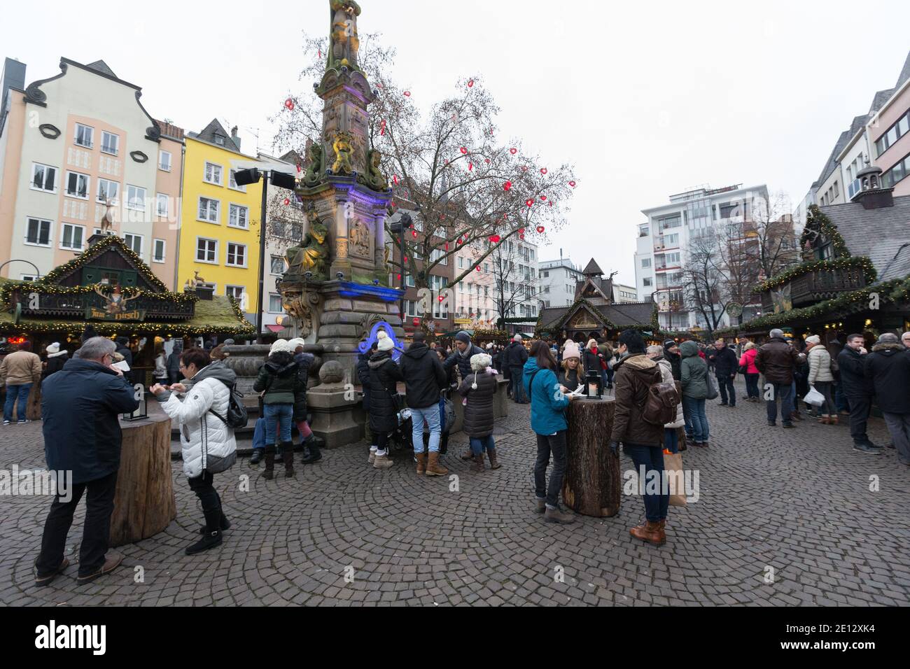 Christmas Market, or Weihnachtsmarkt in the historic Altstadt, or in the old city of Cologne below the Cologne Cathedral. Stock Photo