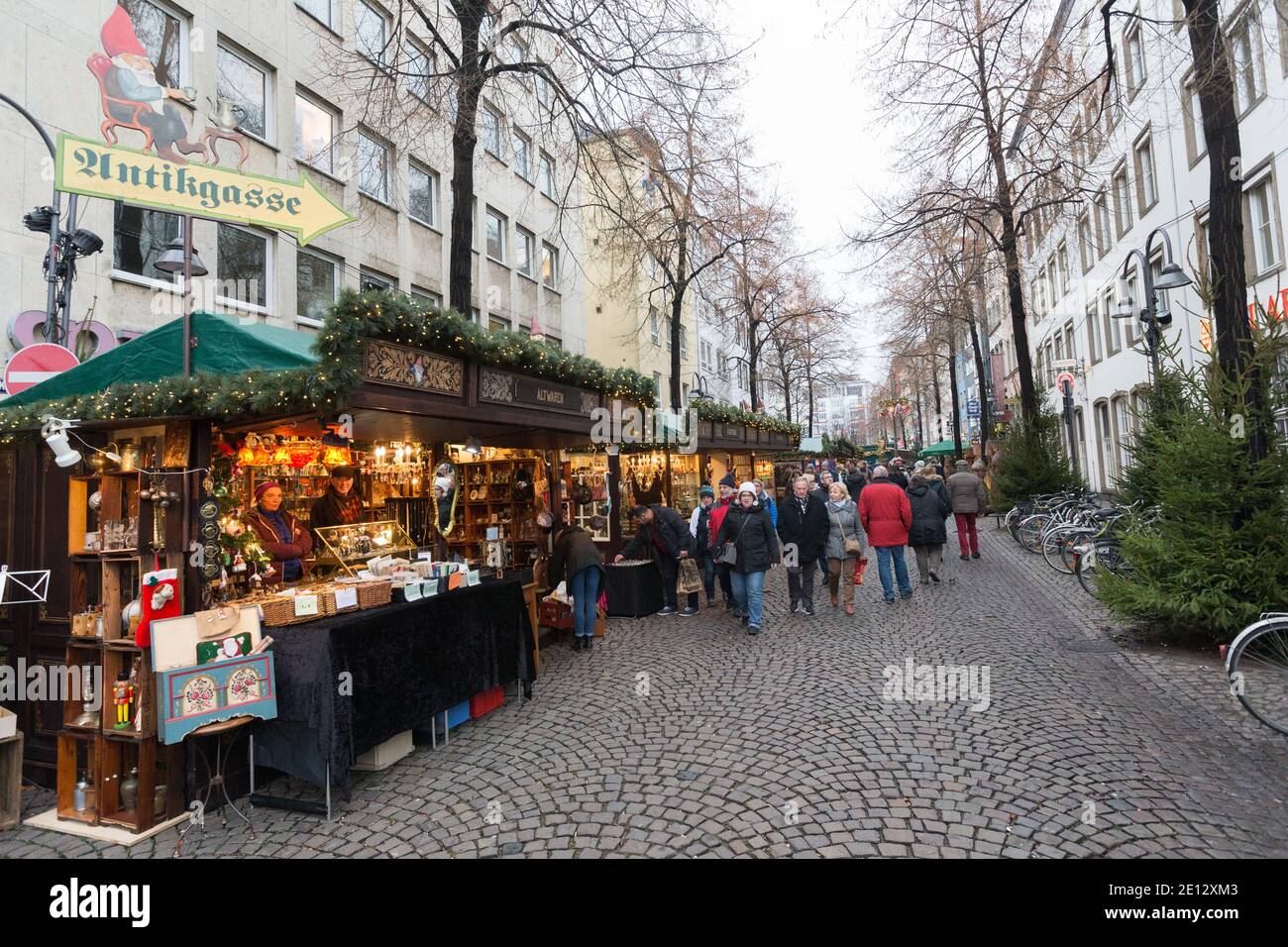 Christmas Market, or Weihnachtsmarkt in the historic Altstadt, or in the old city of Cologne below the gothic Old Town Hall. Stock Photo