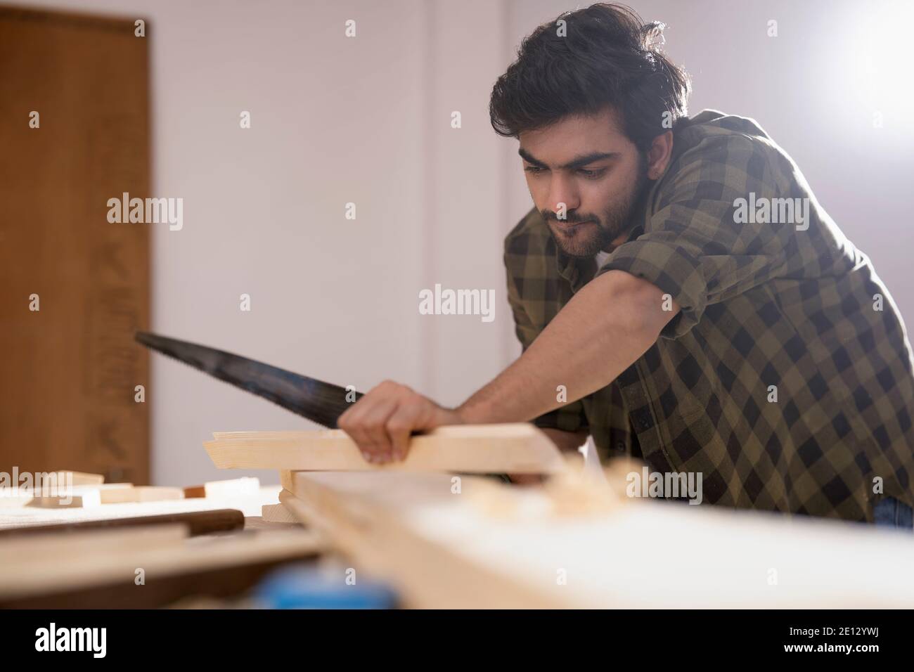 A CARPENTER CAREFULLY USING TOOLS TO CUT WOOD Stock Photo Alamy