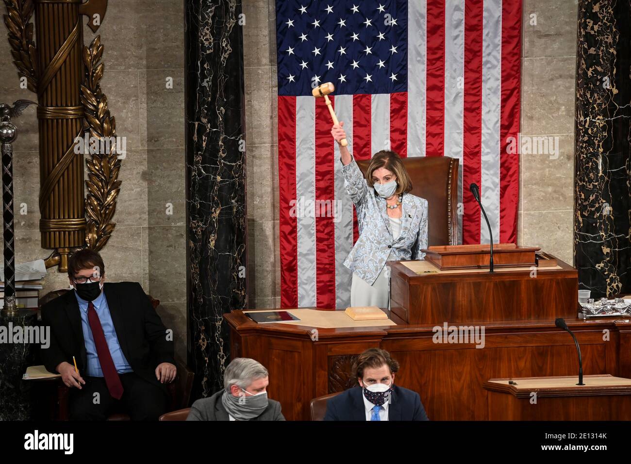 (210104) -- WASHINGTON, D.C., Jan. 4, 2021 (Xinhua) -- U.S. House Speaker Nancy Pelosi waves a gavel during the first session of the 117th U.S. Congress in the House Chamber on Capitol Hill in Washington, DC, the United States, Jan. 3, 2021. Democratic Congresswoman Nancy Pelosi of California was reelected on Sunday as speaker of the U.S. House of Representatives, where her party has a narrow majority. (Bill O'Leary/Pool via Xinhua) Stock Photo