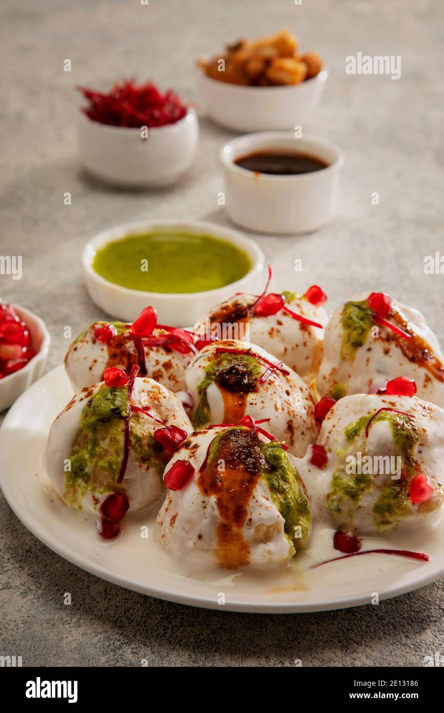 Dahi Vada or Dahi Bhalle a popular Indian snack is fried lentil