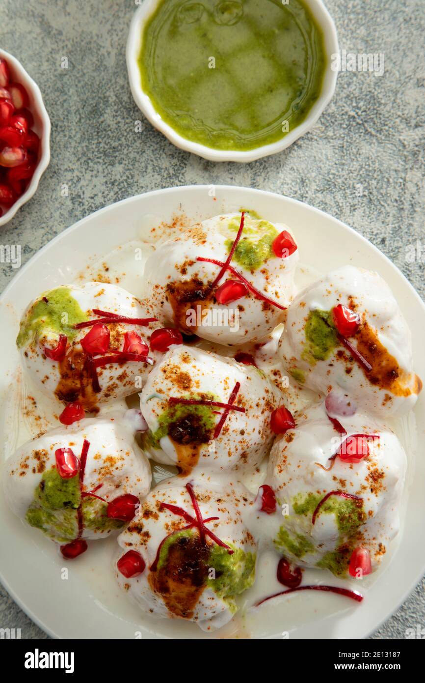 Dahi Vada or Dahi Bhalle a popular Indian snack is fried lentil