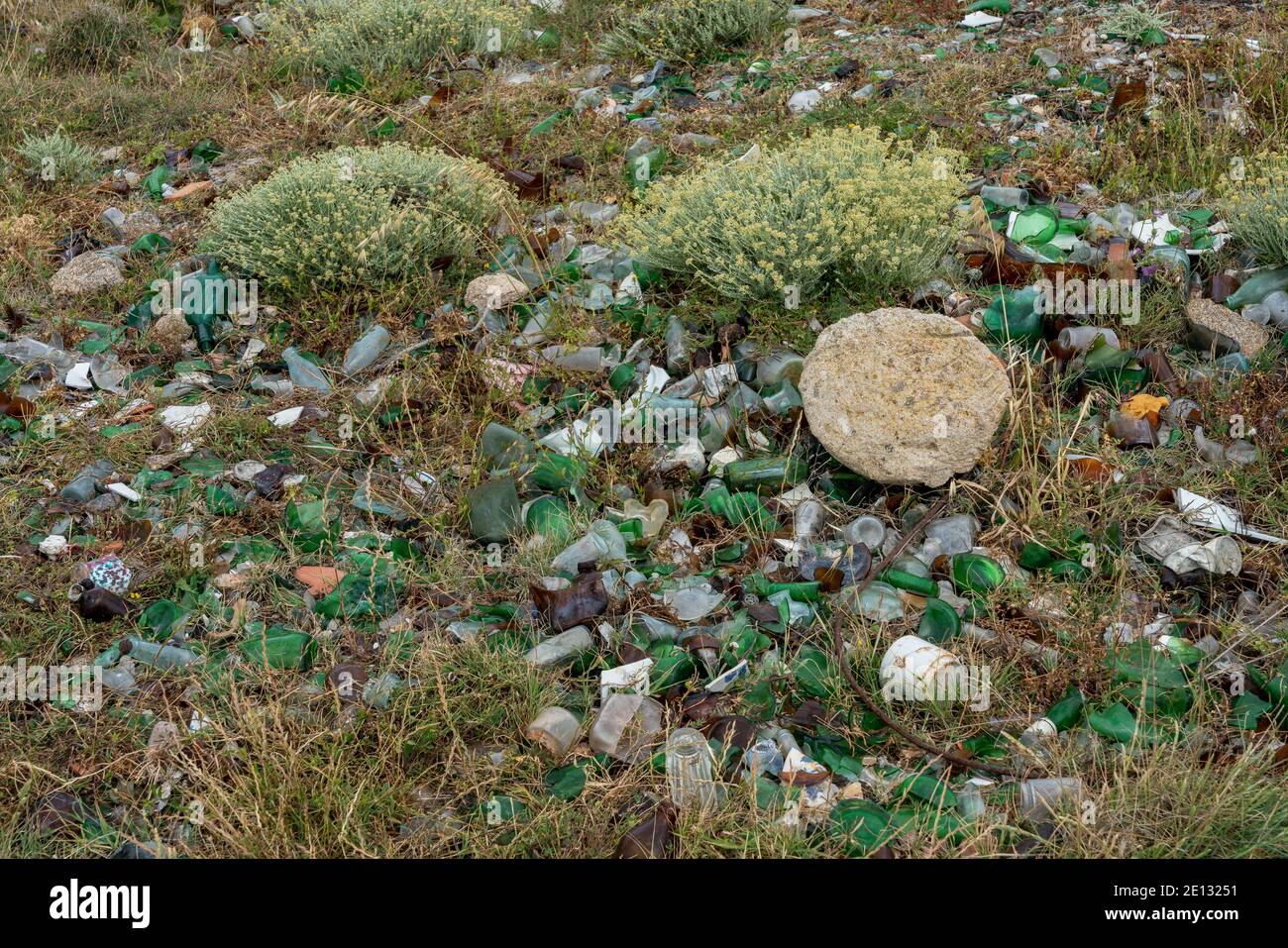 Broken Glass Lies In A Meadow On The Mountain Stock Photo